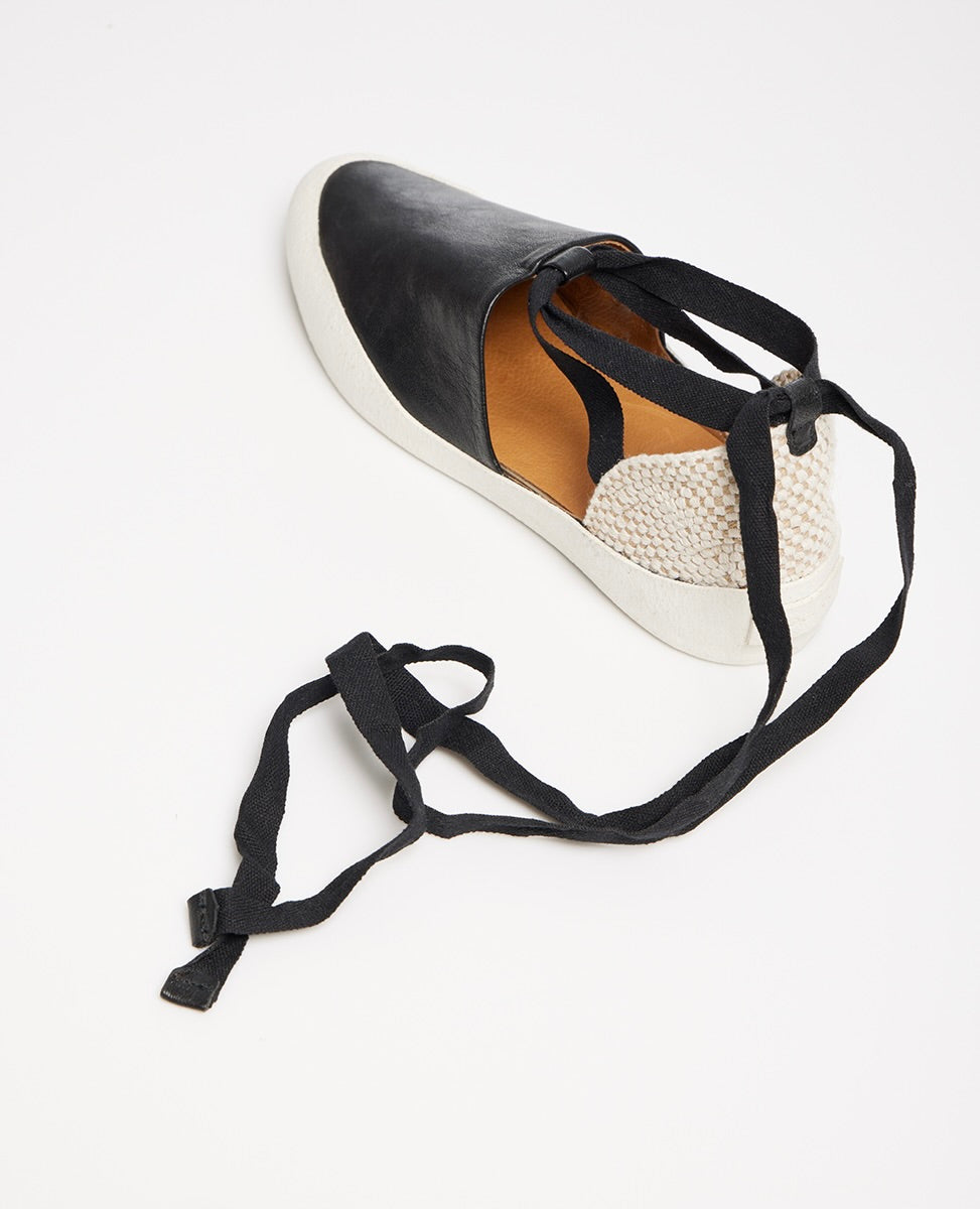 Coclico Kashm Sneaker in Black leather shown from behind highnliting the lace-up espadrille design.