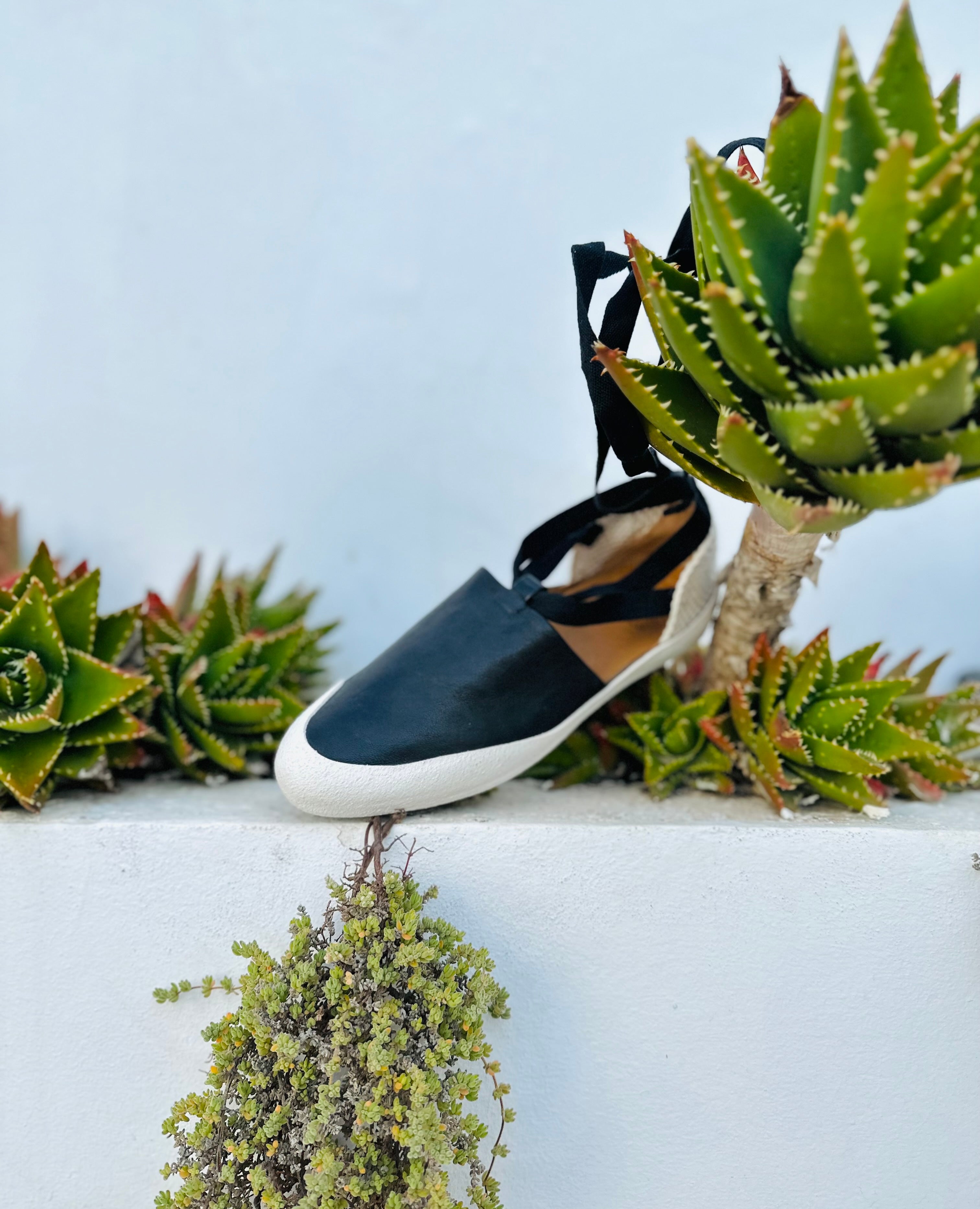 Coclico Kashm Sneaker Espadrille leaning on plants