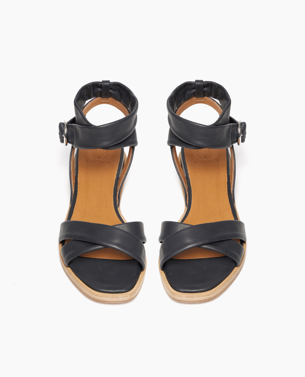 Coclico Katriane Sandal in Deep Sea leather an open sandal with tubular straps across foot and ankle, buckle closure, slight leather wrapped wedge - top view.