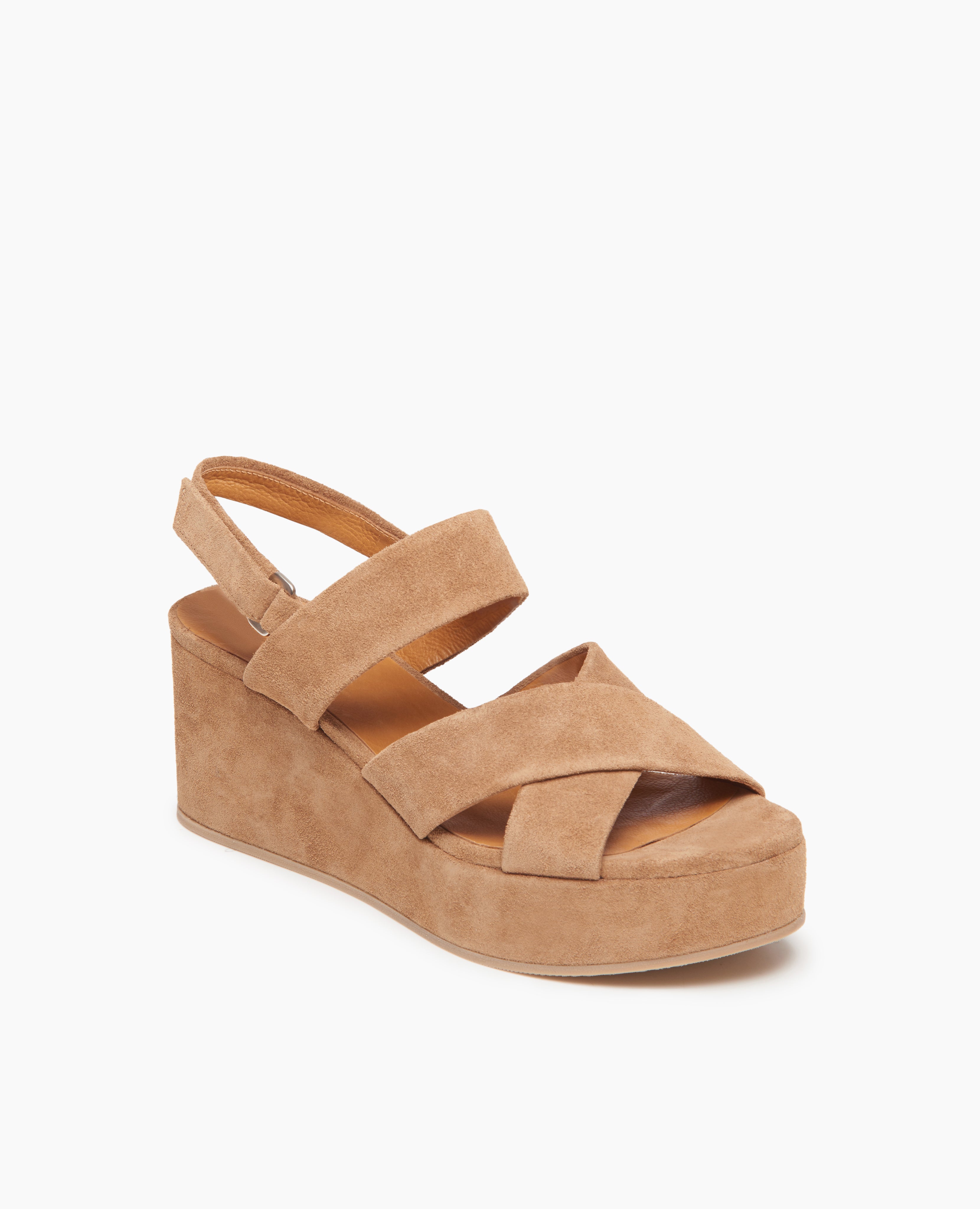 Angle view of Coclico Lacine Wedge in Tobacco suede: Open crisscrossed sandal on a recycled cork wedge platform, back strap. Velcro closure.