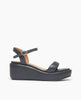 Coclico Lilya Wedge in Deep Sea leather: cork wedge covered in padded leather, tubular padded front band, quarter strap, buckle closure - side view. 1