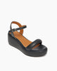 Angle view of Coclico Lilya Wedge in Deep Sea leather: cork wedge covered in padded leather, tubular padded front band, quarter strap, buckle closure. 3