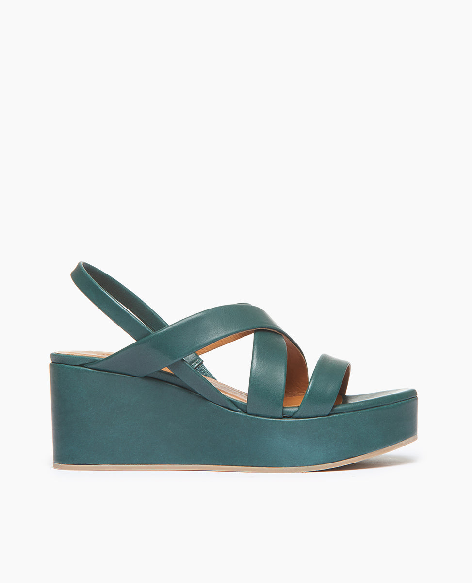 Coclico Lylo Wedge in Riviera Green leather a leather wrapped cork wedge, elasticated slingback strap, crisscrossed straps across foot - side view.