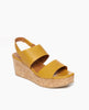 Angle view of Coclico Massy Wedge in Ambra leather: classic solid cork wedge, two leather straps across foot, elasticated back strap. 2