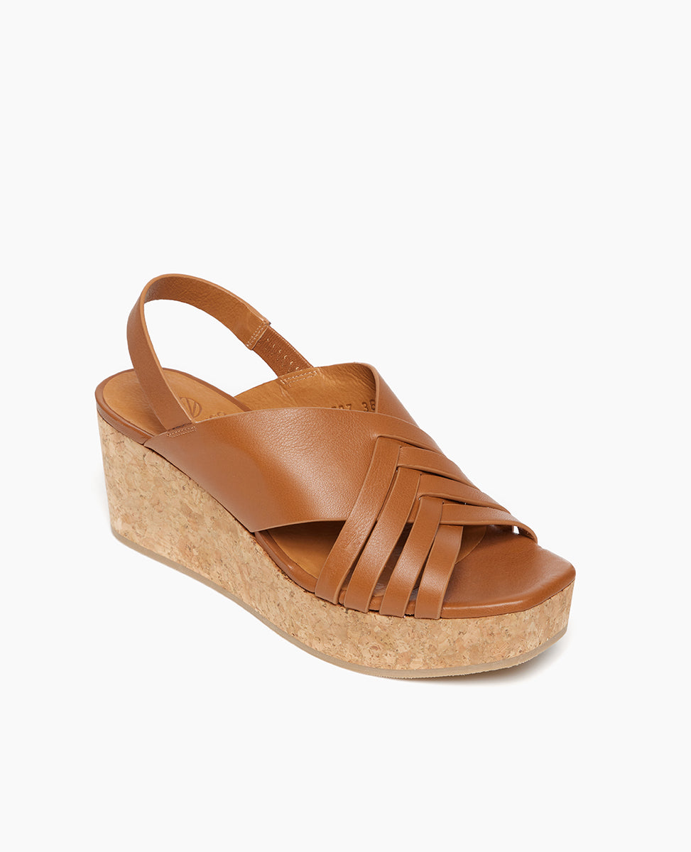 Coclico Moska Wedge in Cuoio leather, angle view: Huarache inspired cork wedge with a woven leather band across foot, slingback strap.
