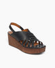 Coclico Moska Wedge in Deep Sea leather a Huarache inspired cork wedge with a slingback strap and a woven leather band across foot - angle view. 2