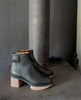 Side view of the Nigella Clog in Deep Sea placed on a furnace. 4