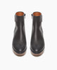 Front view of the Nigella Clog in Deep Sea. Set on a solid wood heel and platform, the midsole is rounded and completely unique, with a simple, clean bootie silhoute. Side tab. Inside-zip closure. 3