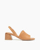 Coclico Okolo Sandal in Mandorla leather, side view: a slingback sandal with a wide stretch leather band across the foot and a softly curved, low, solid walnut wood heel. 1