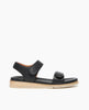 Coclico Peeper Sandal in Deep Sea leather: a two-strap, low pine wedge sandal with leather-wrapped footbed, gum-rubber sole. Velcro closure. Side view. 1