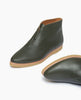 Angle view of the Coclico Pickle Boot in Boscu leather with one boot placed on side showing of pointed toe shape. 3