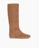 Side view of the Quest Boot in Tobacco: a sleek, split suede, to-the knee boot with a pointed toe, and a half-height inside zip closure with a 30MM hidden wedge inside that adds height and comfort. 1
