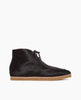 Side view of the Coclico Quinn Boot sophisticated chukka bootie in our limited edition black lux hair. Gentilly pointed moc toe, raised black leather piping and lace closure. Inside you'll discover a 30MM hidden wedge that adds height and comfort. 2
