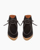 Front view of the Coclico Quinn Boot sophisticated chukka bootie in our limited edition black lux hair. Gentilly pointed moc toe, raised black leather piping and lace closure. Inside you'll discover a 30MM hidden wedge that adds height and comfort. 4
