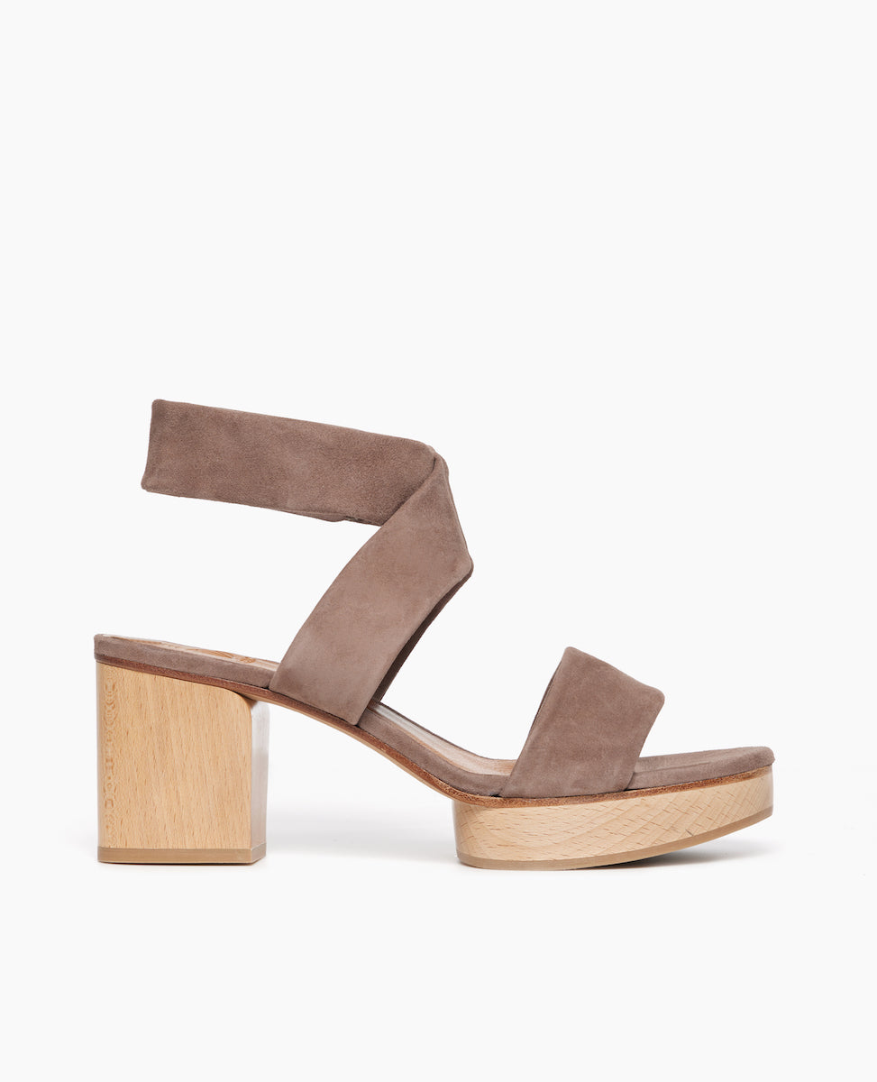 Side view: Coclico Robin Clog in Smoke suede: tubular band across foot, crisscrossed tubular ankle strap with a softly curved solid wood heel with matching solid wood platform.