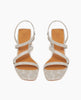 Coclico Shirin Heel in Platino Emboss (textured) leather, top view: Open sandal with asymmetrical string-like straps across foot, solid mid-height wood heel. 3