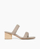 Side view: Coclico Sofiya Heel in Limestone nubuck: a slide-on sandal with a low-height solid wood triangular heel, two padded leather straps across foot, angular toe and heel design. 1