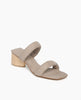 Coclico Sofiya Heel in Limestone nubuck a slide-on sandal with a low-height solid wood triangular heel, two padded leather straps across foot, angular toe and heel design - angle view. 2