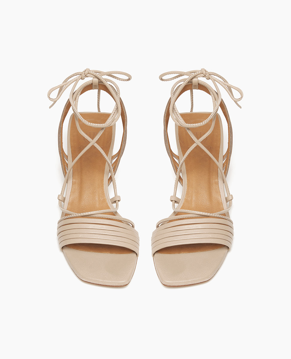 Top view: Coclico Solomiya Heel in Grey Mist leather: gladiator-style sandal with thin leather straps across vamp of foot and a low-height, solid-wood, angular heel.