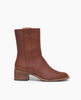 Side view: Coclico Sracha Boot in Caramello leather, timeless boot with a low-height solid wood block heel, rounded toe and a decorative vertical strap that is placed opposite to the inside zip closure. 1