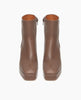 Front view of the Travis Boot in Taupe. This boot features a squared to box and is balanced with a platform. 3