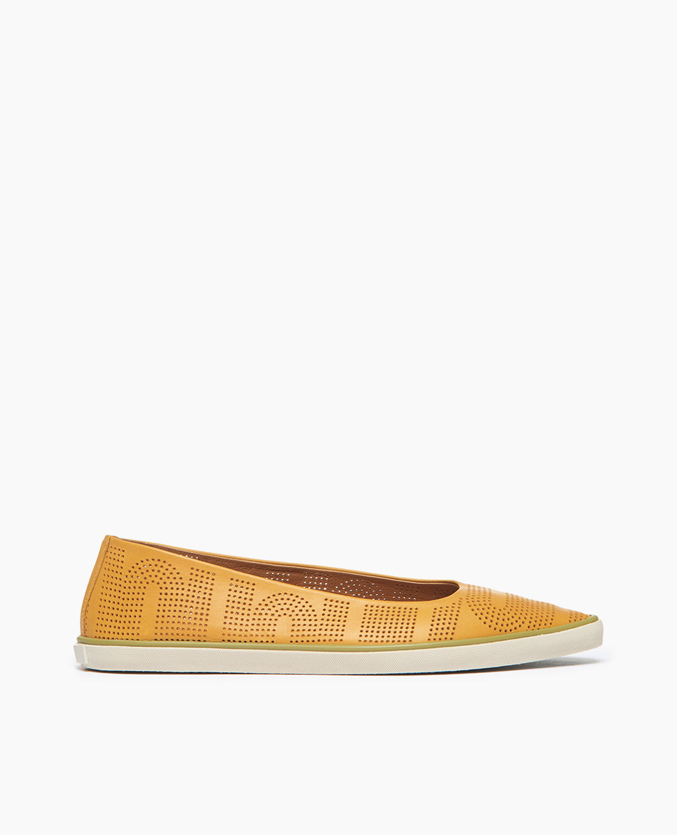 Side view: Coclico Usha Sneaker in Ambra Perfed leather, a ballet flat inspired slip-on sneaker with a pointed toe, low profile rubber sole and pinhole rendering of Coclico's signature infinity arches.