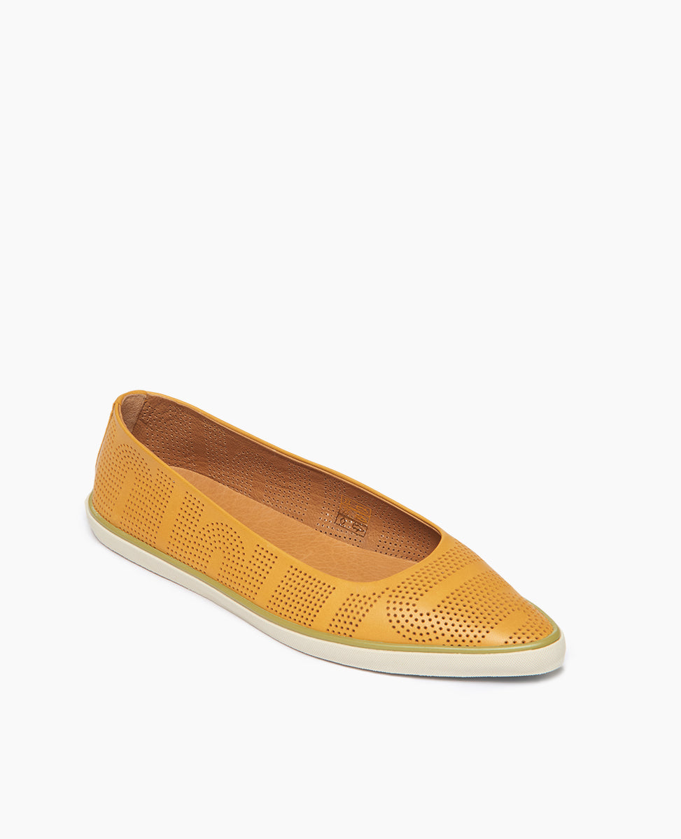 Coclico Usha Sneaker in Ambra Perfed leather: ballet flat inspired slip-on sneaker with a pointed toe, low profile rubber sole and pinhole rendering of Coclico's signature infinity arches - angle view.
