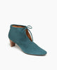 Angle view: Coclico Waffles Boot in Bottle suede, the perfect dress-up bootie featuring a 50mm softly arched solid wood heel, gathered tie at the ankle which reveals top of the foot and a pointed toe. 2