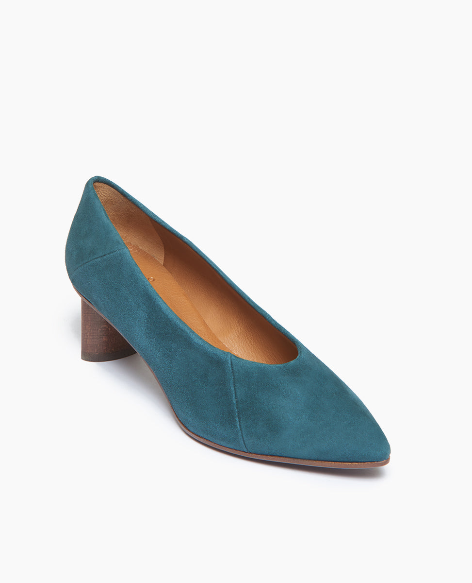 Coclico Wumo Heel in Bottle suede, a seasonless slip-on heel with a choked throat line, subtle stichwork and a scultped, oval shaped solid wood heel with a hand-painted chestnut finish - angle view.