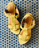 Top view of Coclico Ally Clog in Certosa suede: an open t-strap sandal on solid wood wedge platform, velcro closure on blue tiled floor. 5