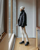 Full body shot of woman modeling the Coclico Cappucho Boots in Black leather. 7