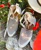 Close up of the Kashm sneaker on a field of poppies. 7