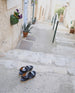 The Pepper sandal at the top of a stepped sidewalk in france. 2