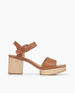 Side view of Coclico Riviera Clog in Cuoio leather: wide front band, quarter-strap, buckle closure, with a solid wood platform to match the solid wood mid-height heel. 1