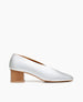Coclico women's effortless everyday mid pump with sweetheart-cut in bright iridescent silver leather. Coclico shoes are sustainably made in Spain. 1