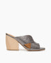 Coclico women's flattering slide featuring sweetheart lines and toe opening in a metallic gunmetal leather with a sculpted wood heel. Coclico shoes are sustainably made in Spain. 1