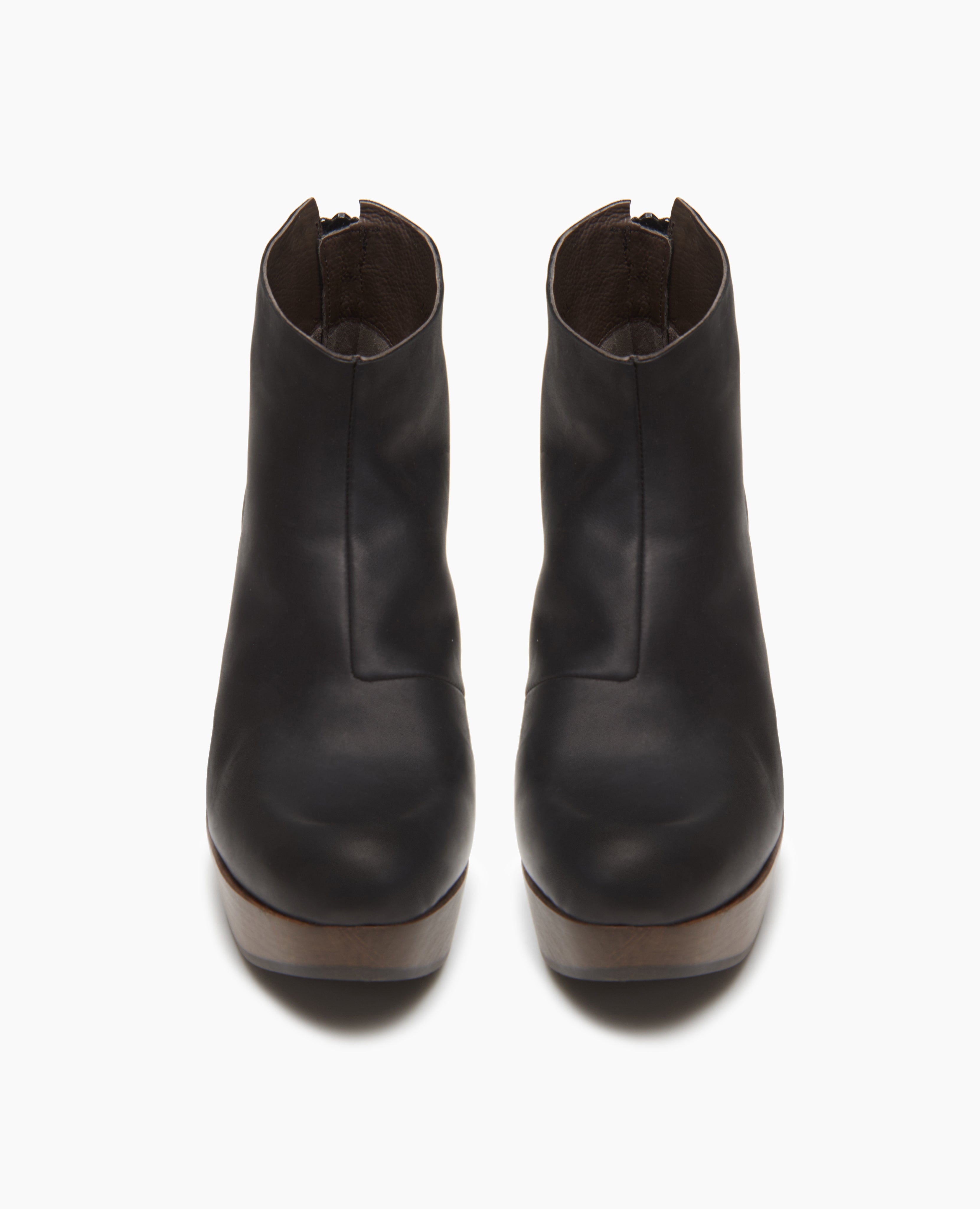 Front view of the Tik clog: a classic clog bootie faturing an asymmetrical oprning at the ankle for a flattering fit. Back zip closure.
