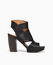 Coclico women's detailed black leather wrapped upper with wooden platform and heel offers height and comfort. Coclico shoes are sustainably made in Spain. 1