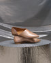 Coclico women's babouche inspired everyday flat with elegant cut in iridescent peach metallic leather. Coclico shoes are sustainably made in Spain. 2