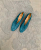 Outdoor top view shot of the Coclico Harissa Flat in Bottle suede, featuring a high vamped flat with a softly rounded toe, leather sole and a 10mm solid wood heel. 4