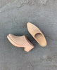 Coclico Kule Clog in Latte nubuck: a classic slip-on mule with a tapered toe and mid-height solid wood base - top view on concrete flooring. 2