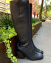 Outdoor, side view of a tall boot with ruched heel, 75mm solid wood block heel, rounded toe.  3