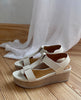 Close up side view of Coclico Ally Clog in Greige leather: an open t-strap sandal on a wood wedge platform. Velcro closure. 4