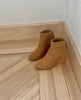 Coclico Lovage Boot in Wheat suede on wood flooring showing off softly rounded toe. 5