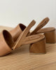 Close up of Coclico Okolo Sandal in Mandorla leather slingback heel and softly curved, low, solid walnut wood heel. 4