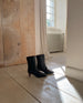 Wakame Boot in Leather in a room with the sun shining.  6
