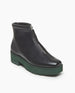 Angle view: Coclico Chickadee Shearling Boot in Black leather, with weather-conscious leather, upper zipper closure, shearling lining, padded edge, angular toe, green mid-height EVA sole. 5
