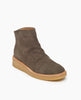 Coclico Hop Boot in Anthracite suede: a crepe-soled wedge with a .5 inch height, leather welt, natural soft wrinkles and a patinated metal back zipper closure - angle view. 3