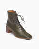 Coclico Jewel Boot in Boscu leather, a glove leather lace-up with a squared-off toe, welted leather sole, mid-height solid wood block heel, inside zip closure - angle view. 2