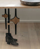 Side view of the reimagined chelsea boot with stretch elastic gussets, leather pull tab, squared-off toe and a black mid-height solid wood heel - Coclico Ruba Clog in Black leather with wood table in background. 6